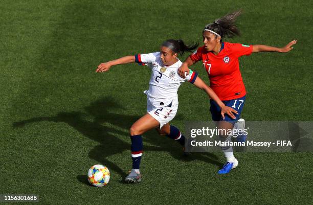 Mallory Pugh of the USA is challenged by Javiera Toro of Chile during the 2019 FIFA Women's World Cup France group F match between USA and Chile at...