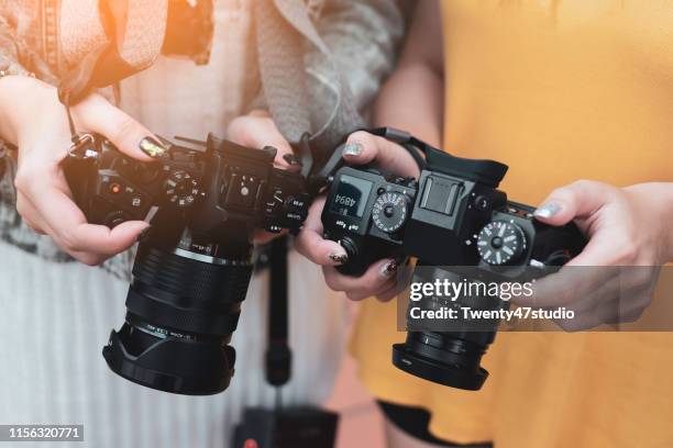 photographers show image on screen each others, discuss and arrangement concept. - camera crew stockfoto's en -beelden