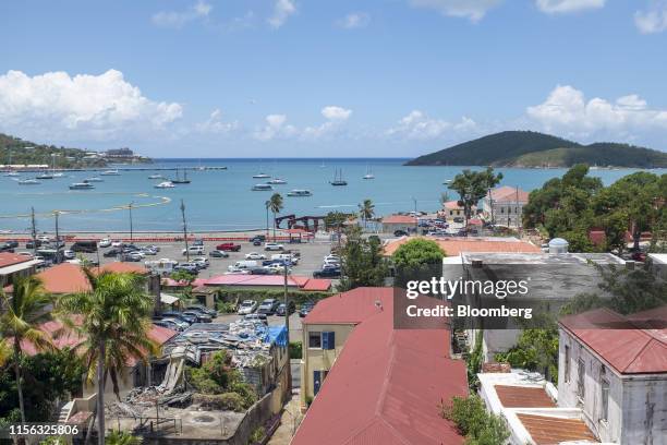 Boats sit in a bay in St. Thomas, U.S. Virgin Islands, on Thursday, July 11, 2019. Little St. James Island is where Epstein - convicted of sex crimes...