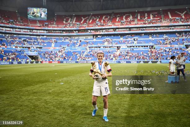 Women's World Cup Final: USA Megan Rapinoe victorious with FIFA World Cup trophy, Golden Ball trophy and Golden Boot trophy after winning game vs...