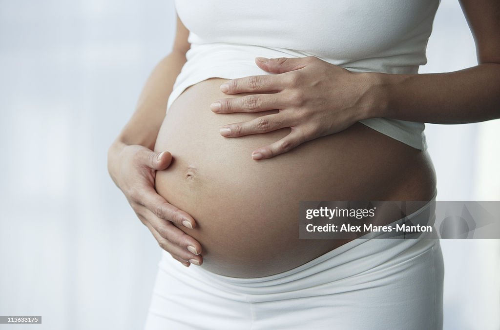 Hands on pregnant stomach