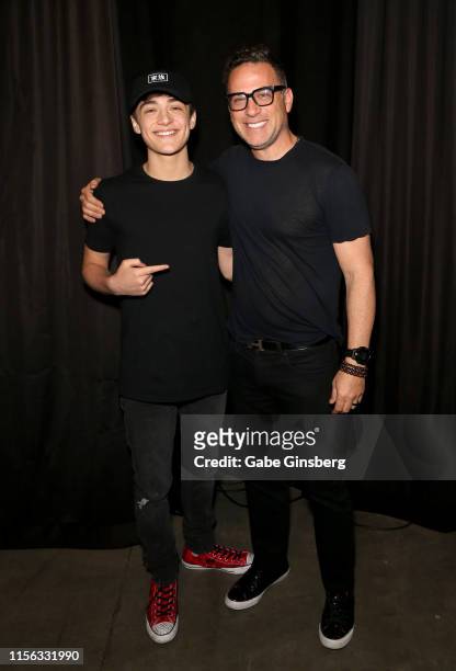 Actor Asher Angel and his father Jody Angel pose backstage after the "Shazam! Behind the Scenes" panel during the Seventh Annual Amazing Las Vegas...