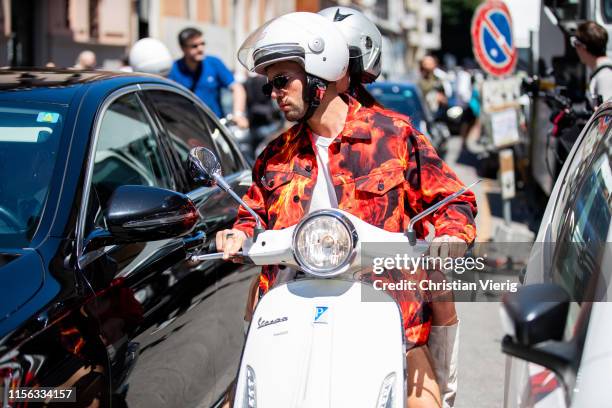 Couple Alice Barbier and Jean-Sebastian Rocques seen on a vesoutside Etro during the Milan Men's Fashion Week Spring/Summer 2020 on June 16, 2019 in...