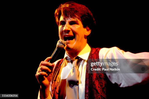 English New Wave singer Tony Hadley, of the group Spandau Ballet, performs onstage at the Shubert Theatre, Chicago, Illinois, December 1, 1983.