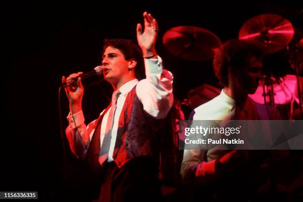 English New Wave singer Tony Hadley and Gary Kemp, on guitar, both of the group Spandau Ballet, perform onstage at the Shubert Theatre, Chicago,...