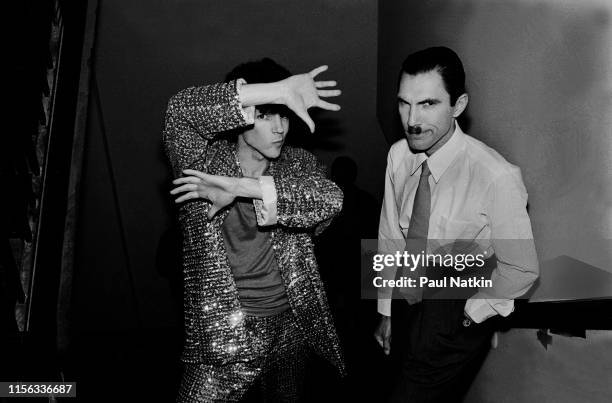 Portrait of American sibling New Wave and Rock musicians Russell and Ron Mael, both of the group Sparks, as they pose on staircase at Stages...