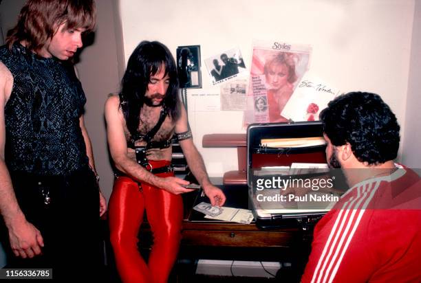 British-American comedian Christopher Guest , in costume as British musician Nigel Tufnel of the group Spinal Tap, watches as American comedian Harry...
