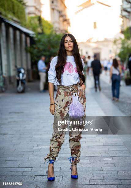 Gilda Ambrosio is seen wearing camouflage pants outside Palm Angels during the Milan Men's Fashion Week Spring/Summer 2020 on June 16, 2019 in Milan,...