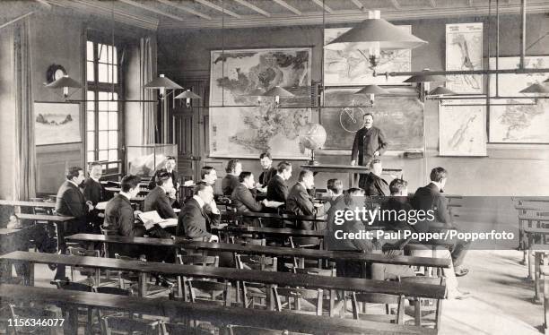 Students of geography and the physics of the globe in a classroom at the Sorbonne in Paris, circa 1910.