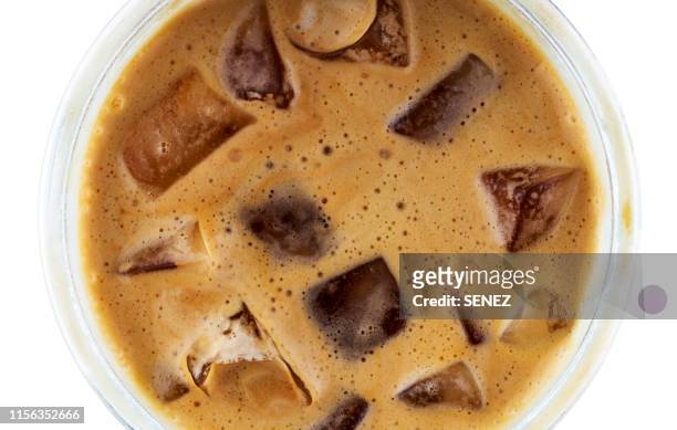 directly above shot of iced coffee over white background - coffee splash stock pictures, royalty-free photos & images