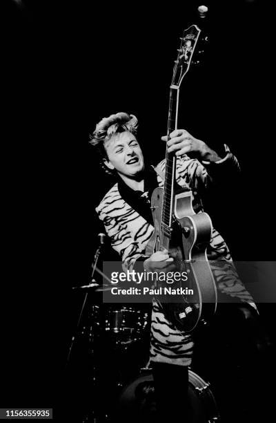 American Rockabilly musician Brian Setzer, of the group Stray Cats, plays guitar as he performs onstage at the Park West, Chicago, Illinois, October...