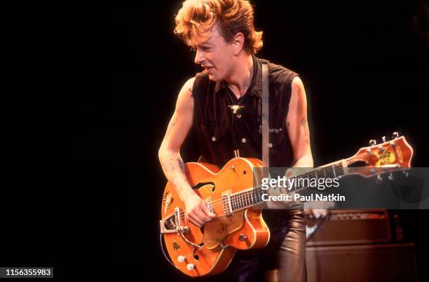 American Rockabilly musician Brian Setzer, of the group Stray Cats, plays guitar as he performs onstage at the Park West, Chicago, Illinois, October...