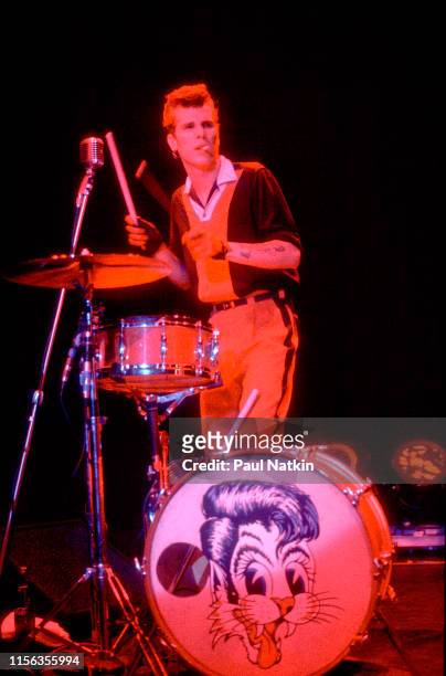 American Rockabilly musician Slim Jim Phantom , of the group Stray Cats, plays drums as he performs onstage at the Park West, Chicago, Illinois,...