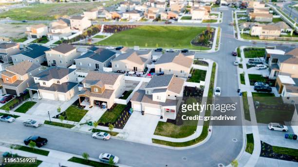 aerial drone view of new construction and existing homes in a residential district in salt lake city, utah - utah house stock pictures, royalty-free photos & images