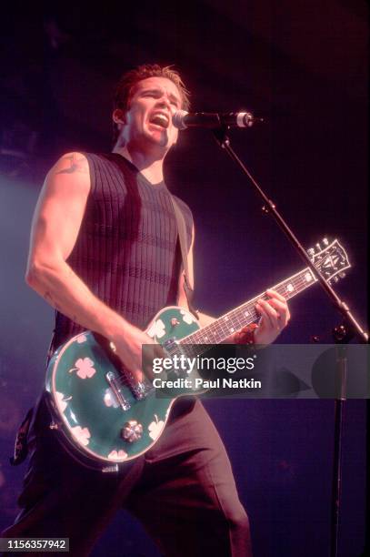 American Pop and Rock musician Mark McGrath, of the group Sugar Ray, plays guitar as he performs onstage at the Odeum, Villa Park, Illinois,...