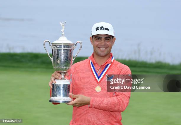 Gary Woodland of the United States holds the U.S.Open trophy after his three shot victory in the final round of the 2019 U.S.Open Championship at the...