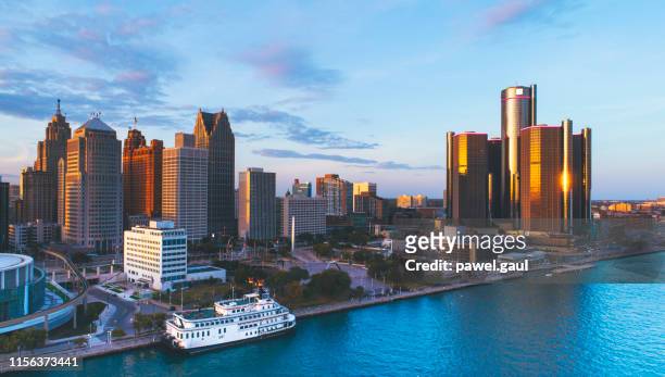 detroit michigan downtown skyline aerial sunset - michigan stock pictures, royalty-free photos & images
