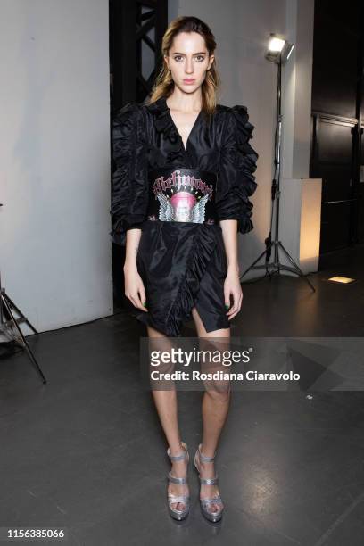Model Teddy Quinlivan at the John Richmond backstage during the Milan Men's Fashion Week Spring/Summer 2020 on June 16, 2019 in Milan, Italy.