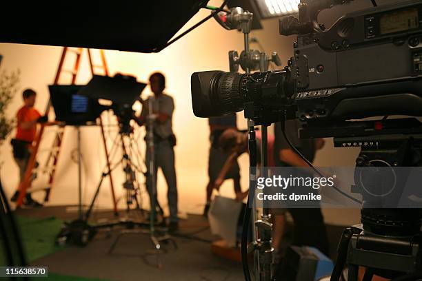 photo tv studio crew with camera - crew stockfoto's en -beelden