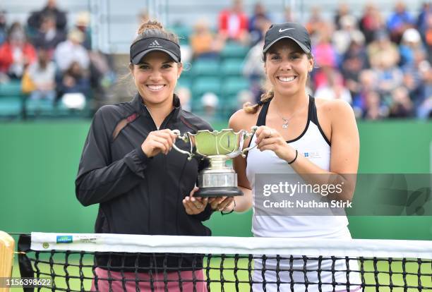 Desirae Krawczyl of the United States and Giuliana Olmos of Mexico pose with their trophy after winning the women's doubles against Ellen Perez and...