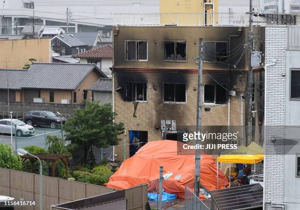 An overview of the Kyoto Animation company studio which was set on fire killing at least two dozen people in Kyoto on July 19, 2019. - A suspected...