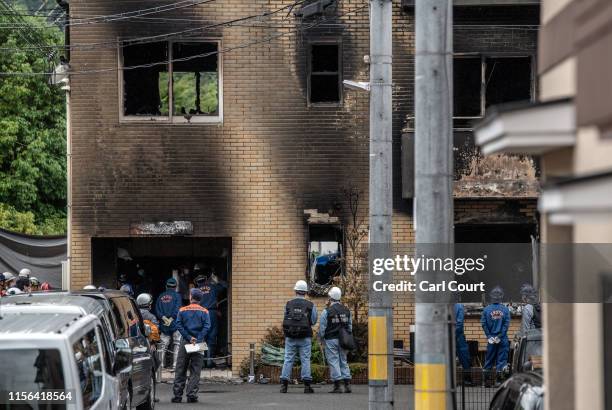 Emergency service personnel inspect the Kyoto Animation Co studio building following an arson attack, on July 19, 2019 in Kyoto, Japan. Thirty three...