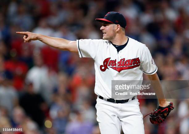 Starting pitcher Trevor Bauer of the Cleveland Indians points to home plate after a pitch against the Detroit Tigers during the seventh inning at...