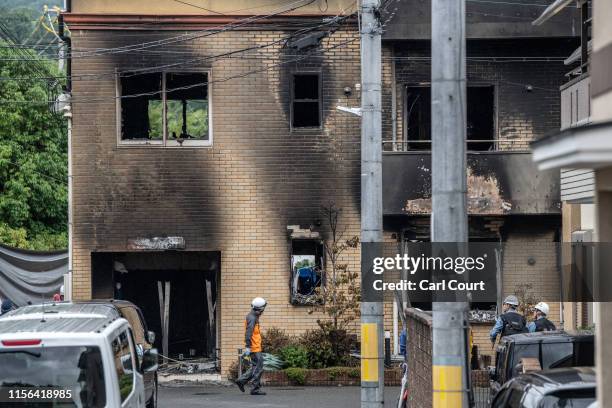 Emergency services personnel work at the Kyoto Animation Co studio building after an arson attack on July 19, 2019 in Kyoto, Japan. Thirty three...