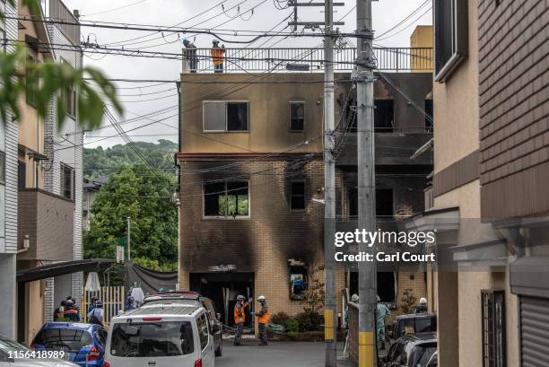 Emergency services personnel work at the Kyoto Animation Co studio building after an arson attack on July 19, 2019 in Kyoto, Japan. Thirty three...