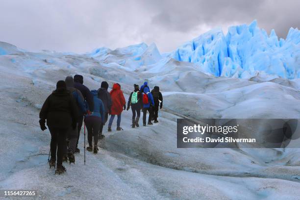 Tourists are seen on two-hour trek on the Perito Moreno glacier, a part of the Southern Patagonian Ice Field, on April 5, 2019 in the Los Glaciares...