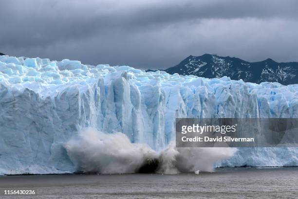 Piece of the Perito Moreno glacier, part of the Southern Patagonian Ice Field, breaks off and crashes into lake Argentina in the Los Glaciares...