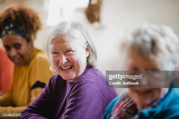 laughing with friends - group of seniors stock pictures, royalty-free photos & images