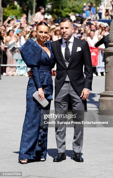 Jordi Alba and Romarey Ventura attend the wedding of Real Madrid football player Sergio Ramos and Tv presenter Pilar Rubio at Seville's Cathedral on...