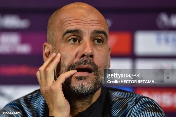 Coach for English Premier League club Manchester City, Pep Guardiola, takes part in a press conference one day before the final matches of the 2019...
