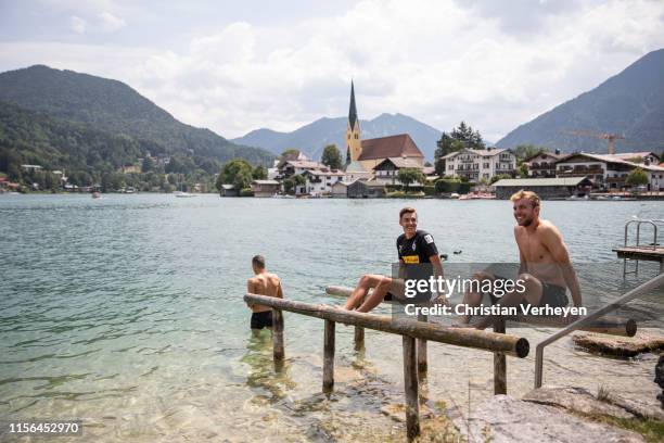 Laszlo Benes, Florian Neuhaus and Christoph Kramer cool down at the Lake Tegernsee after a training session at the Borussia Moenchengladbach Training...