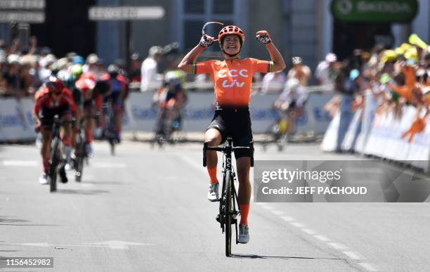 The Netherlands' Marianne Vos celebrates as she crosses the finish line of "La Course by Le Tour", as part of the 106th edition of the Tour de France...