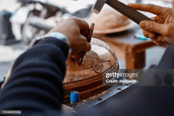 craftsman doing engravings on a copper metal plate - gaziantep city stock pictures, royalty-free photos & images