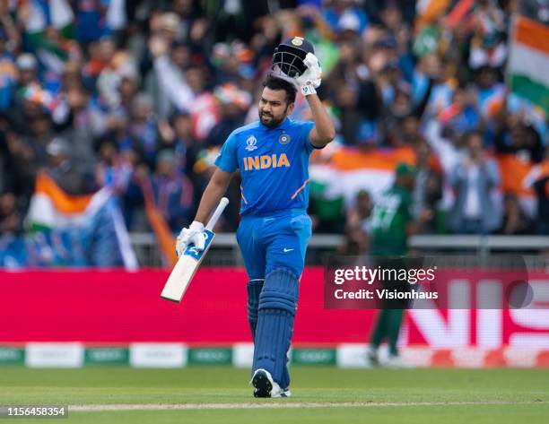 Rohit Sharma of India takes off his helmet and celebrates reaching a century during the Group Stage match of the ICC Cricket World Cup 2019 between...