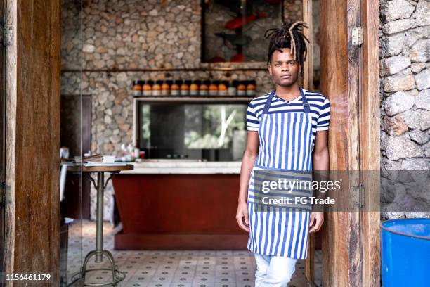 afro confident business owner in front of restaurant - black chef stock pictures, royalty-free photos & images