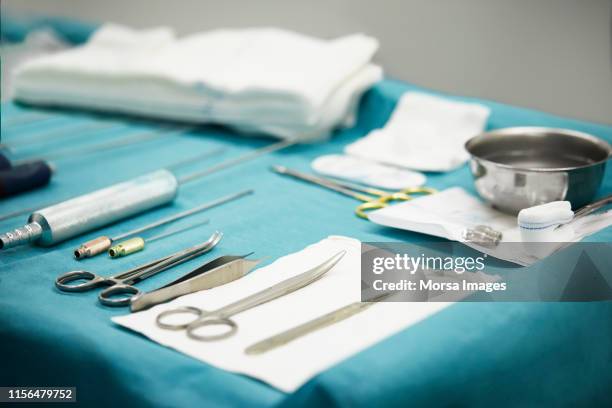 high angle view of surgical equipment on table - liposuccion fotografías e imágenes de stock