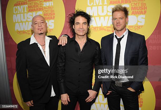 Musicians Jimmy Stafford, Patrick Monahan and Scott Underwood of Train attend the 2011 CMT Music Awards at the Bridgestone Arena on June 8, 2011 in...