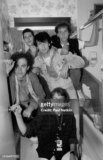 Portrait of American New Wave group the Swimming Pool Q's as they pose backstage at the Bismarck Theatre, Chicago, Illinois, May 2, 1986. Pictured...