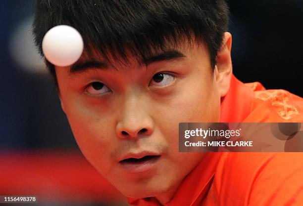 Hao Wang of China serves to Jun Mizutani of Japan in the men's team table tennis competition finals at the 2009 East Asian Games in Hong Kong on...