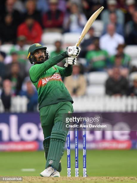 Liton Das of Bangladesh hits a six during the Group Stage match of the ICC Cricket World Cup 2019 between West Indies and Bangladesh at The County...