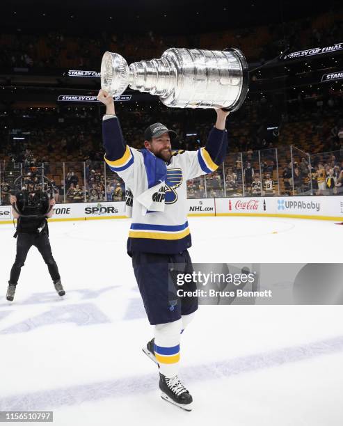 Chris Butler of the St. Louis Blues holds the Stanley Cup following the Blues victory over the Boston Bruins at TD Garden on June 12, 2019 in Boston,...