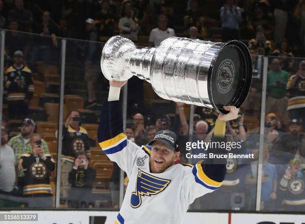 Carl Gunnarsson of the St. Louis Blues holds the Stanley Cup following the Blues victory over the Boston Bruins at TD Garden on June 12, 2019 in...