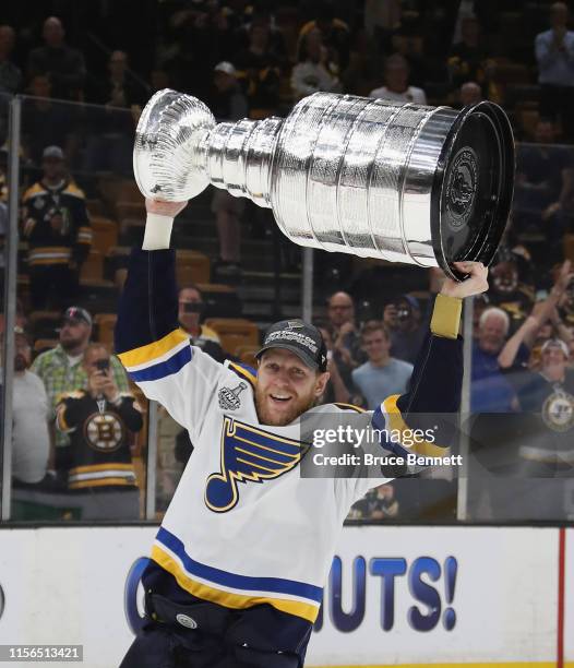 Carl Gunnarsson of the St. Louis Blues holds the Stanley Cup following the Blues victory over the Boston Bruins at TD Garden on June 12, 2019 in...