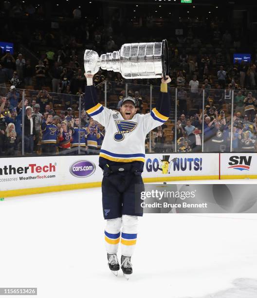 Carl Gunnarsson of the St. Louis Blues holds the Stanley Cup following the Blues victory over the Boston Bruins at TD Garden on June 12, 2019 in...