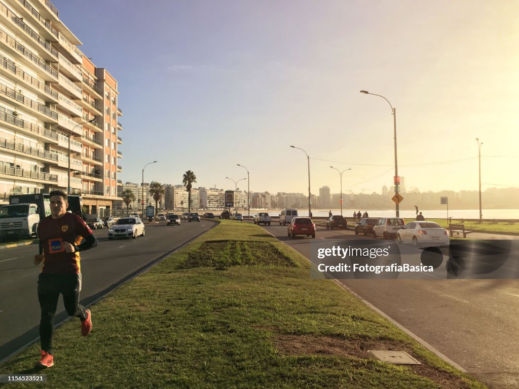 Man jogging in coastal boulevard