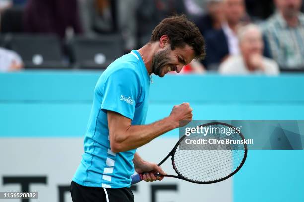 Gilles Simon of France celebrates match point during his First Round Singles Match against James Ward of Great Britain during Day One of the...